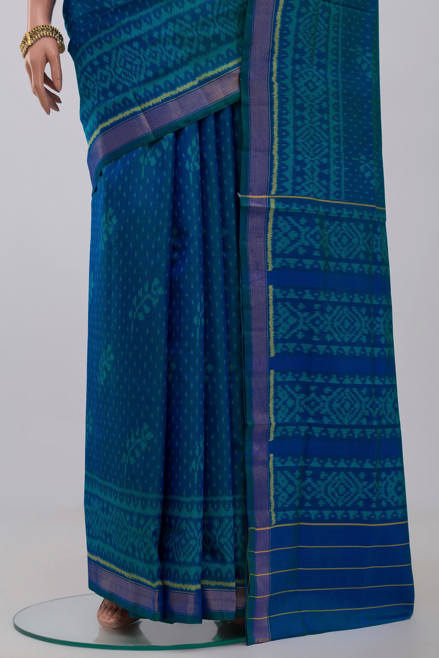 Pleats and pallu of Blue Rajkot Patola Silk Saree with Ikat Print on the body and Zari Border. 