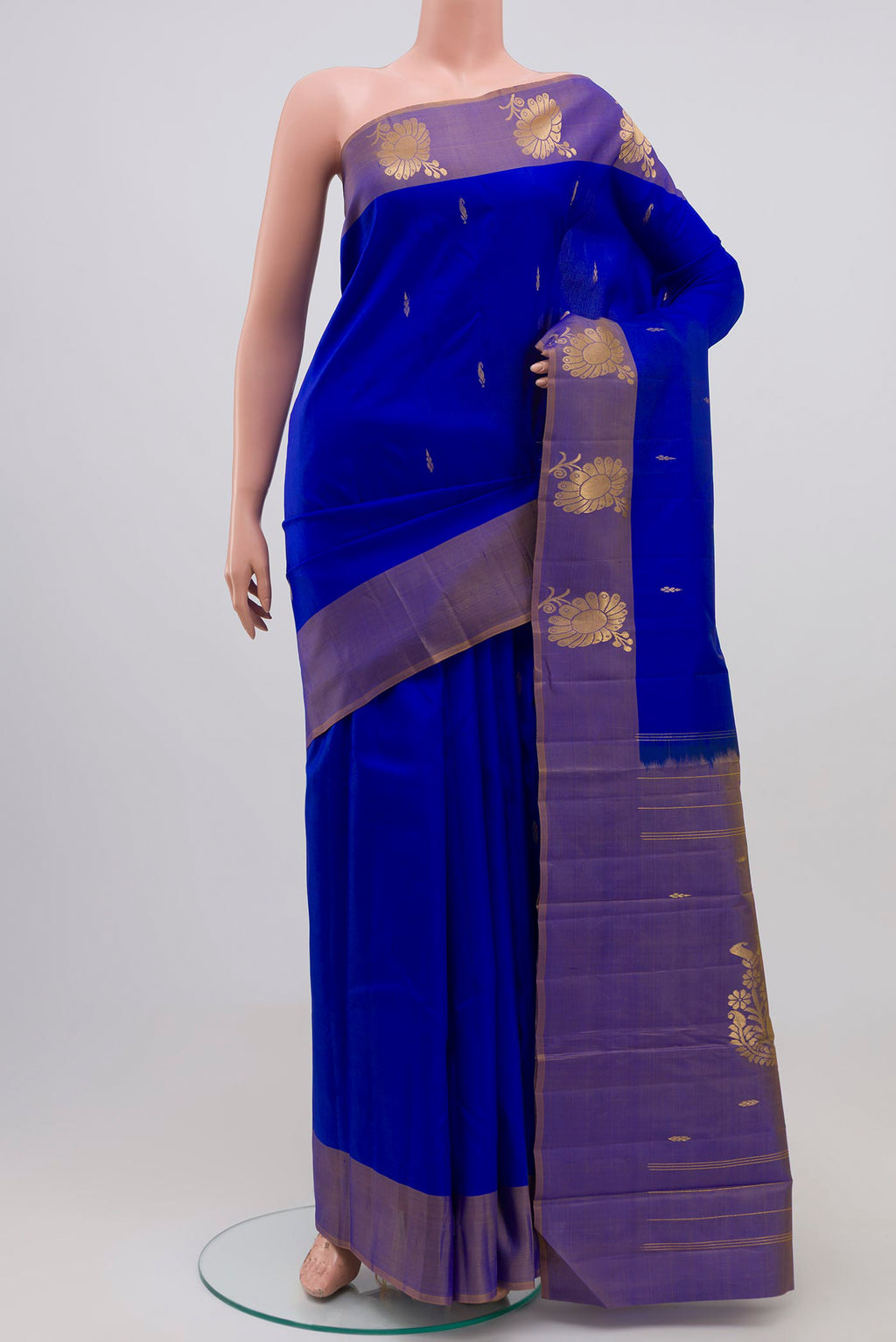 Royal Blue Kanchipuram Silk Saree with Zari Butta on the body and Zari Border.  displayed on a mannequin