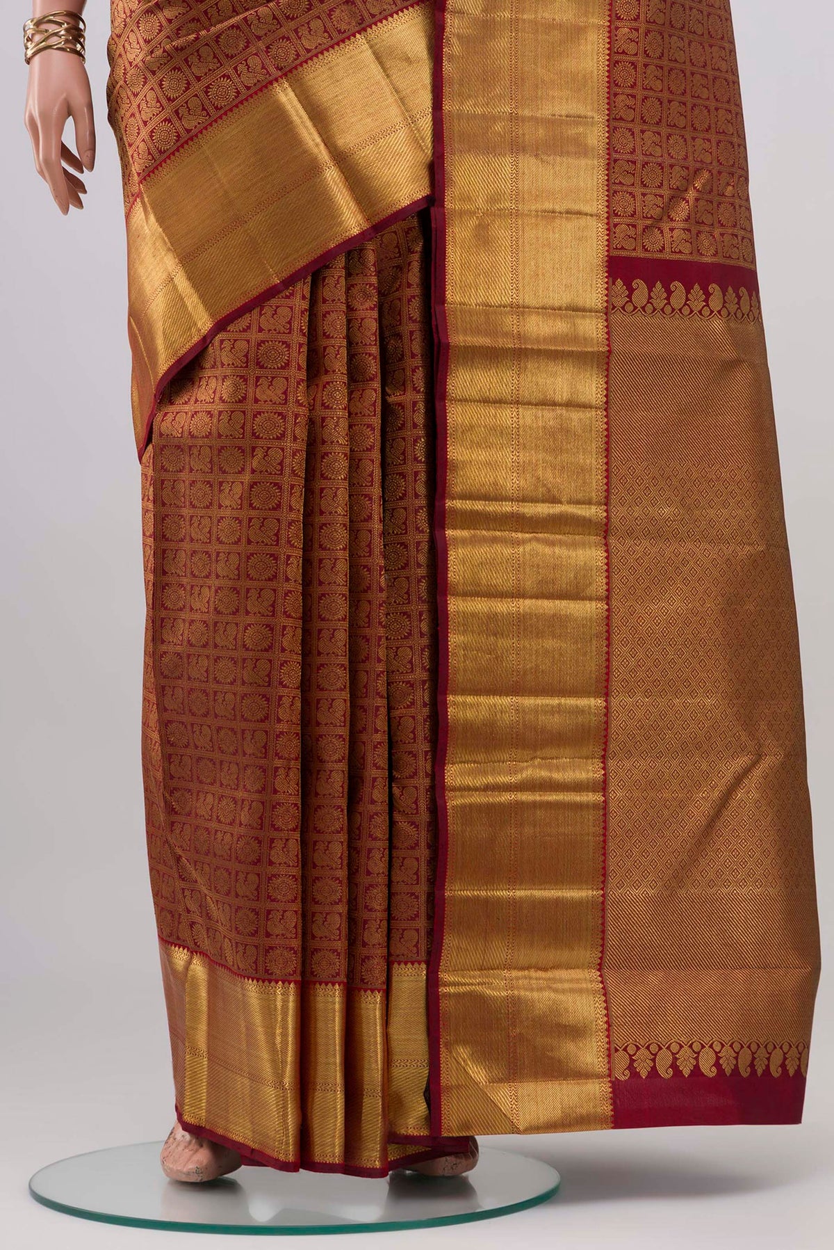 Pleats and pallu of Pure Silk Pure Zari Maroon Kanjivaram Saree with Zari Brocade on the body and Zari Border. 