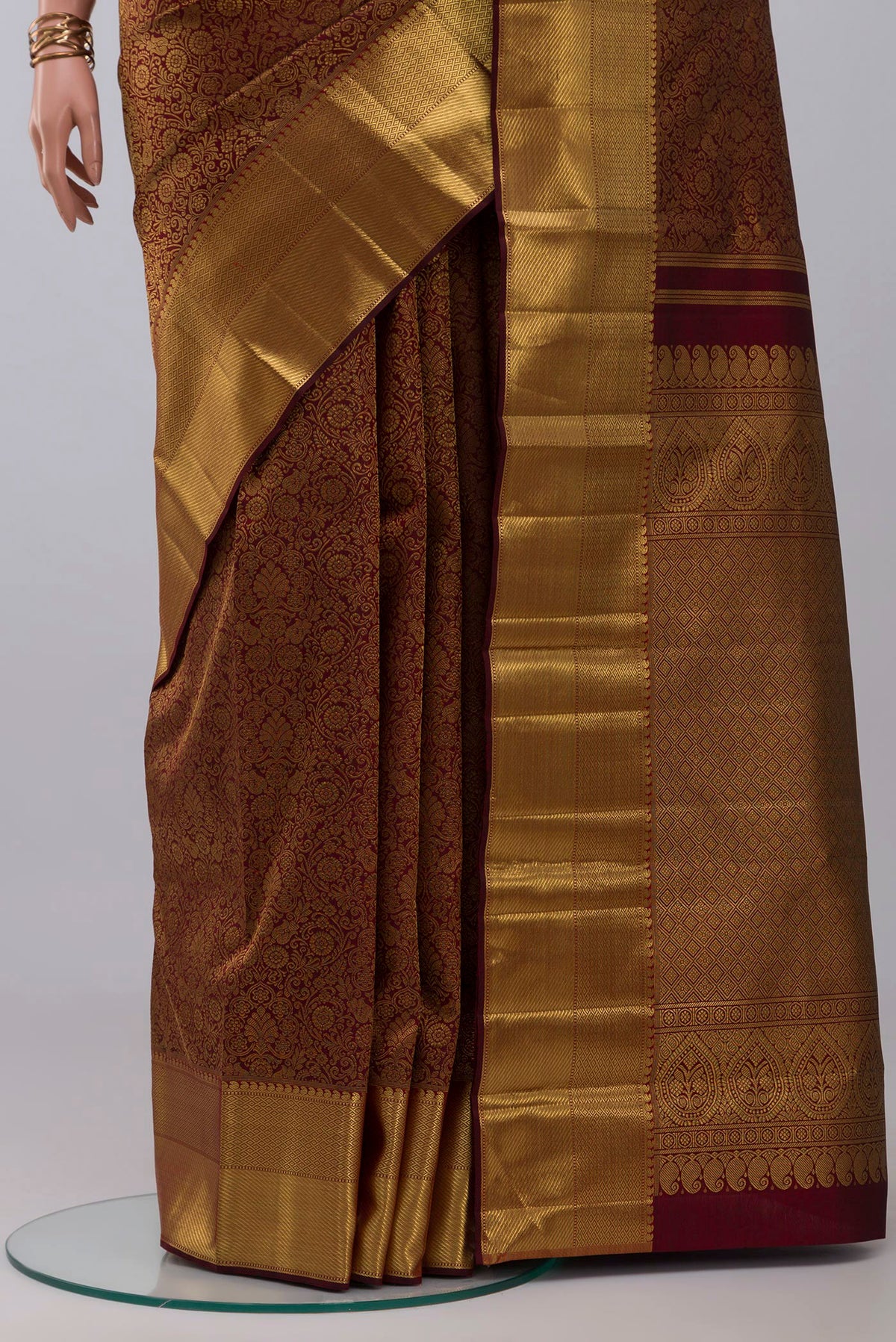 Pleats and pallu of Pure Silk Pure Zari Maroon Kanjivaram Saree with Zari Brocade on the body and Zari Border. 