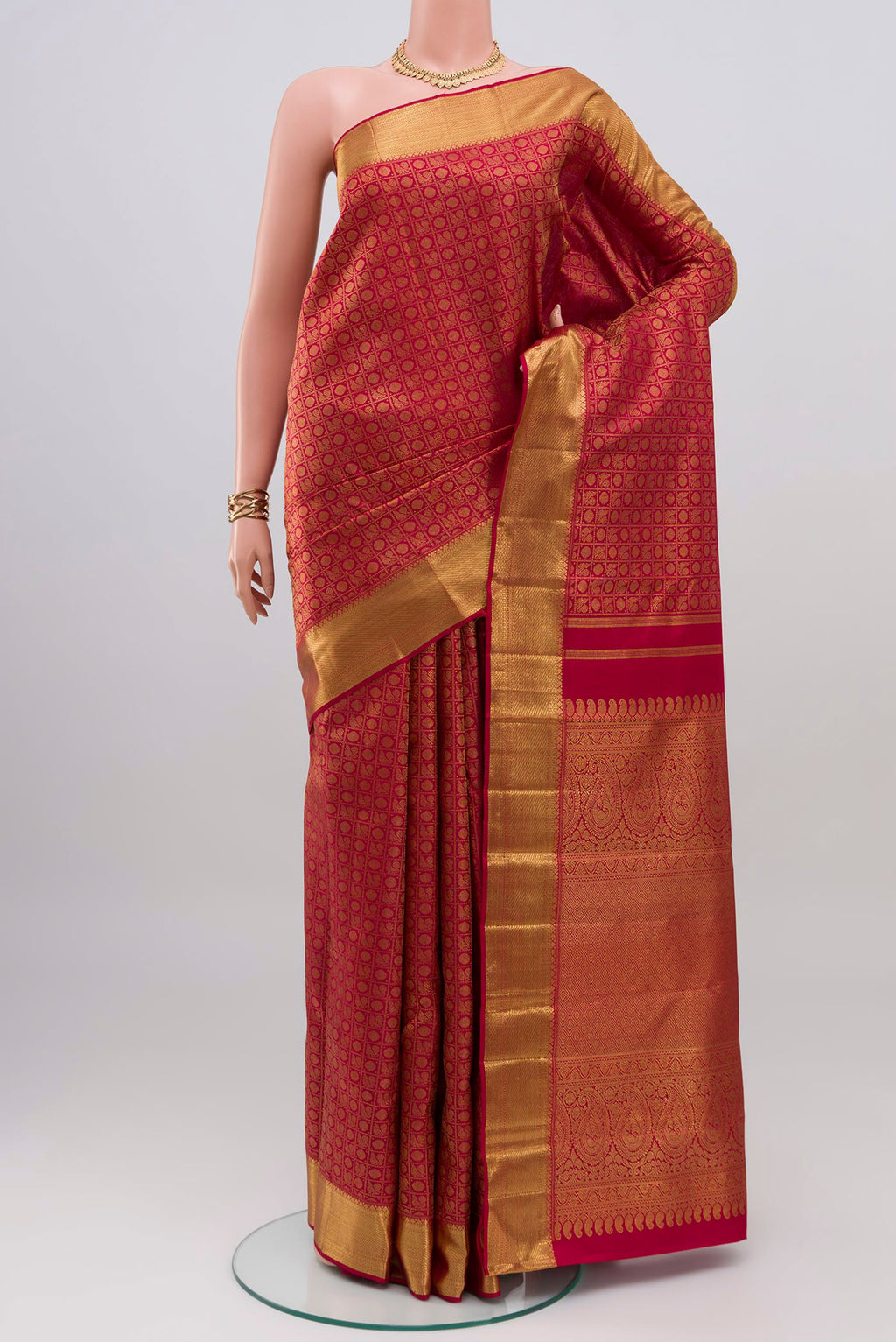 Maroon Kanchipuram Silk Saree with Zari Brocade on the body and Zari Border.  displayed on a mannequin