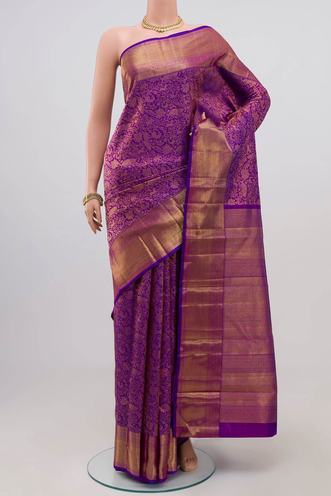 Pure Silk Pure Zari Purple Kanchipuram Saree with Zari Brocade on the body and Zari Border.  displayed on a mannequin