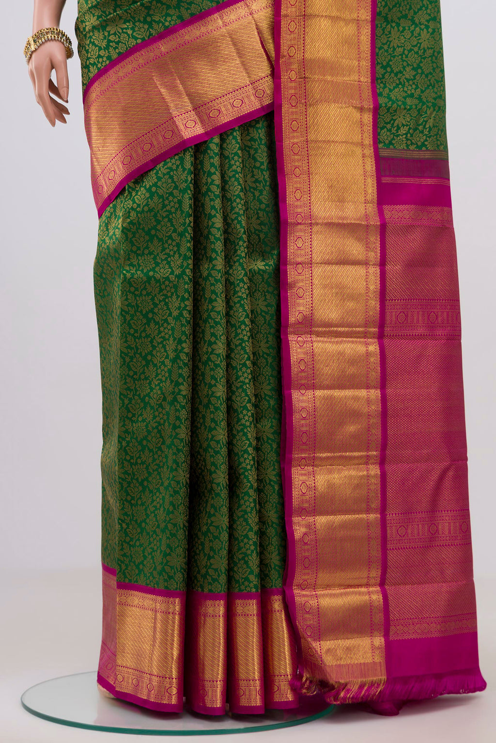 Pleats and pallu of Pure Silk Pure Zari Green Kanjivaram Saree with Zari Brocade on the body and Zari Border. 