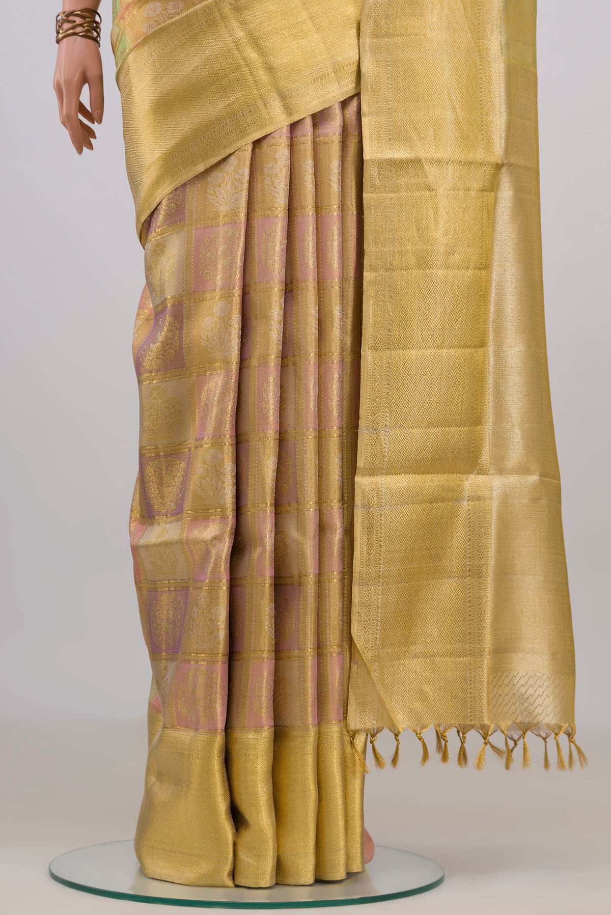 Pleats and pallu of Pure Silk Gold Dual Tone Kanjivaram Tissue Saree with Zari Brocade on the body and Zari Border. 