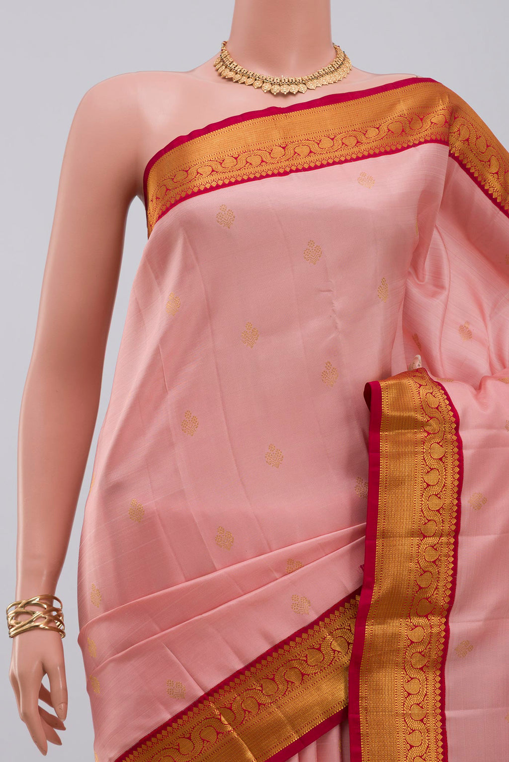 Border image of Peach Kanjivaram Silk Saree with Zari Butta on the body and Zari Border. 