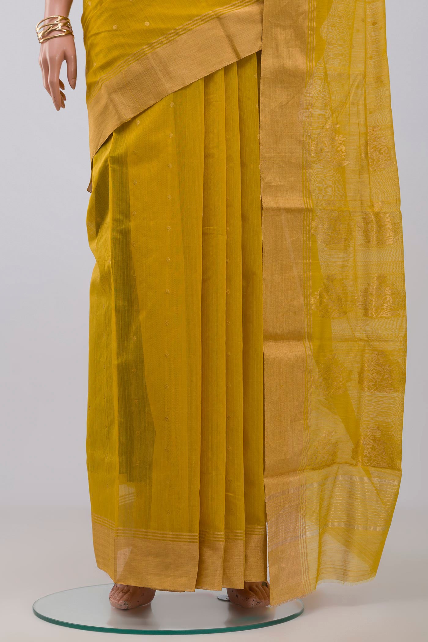 Pleats and pallu of Yellow Chanderi Silk Cotton Saree with Zari Butta on the body and Zari Border. 