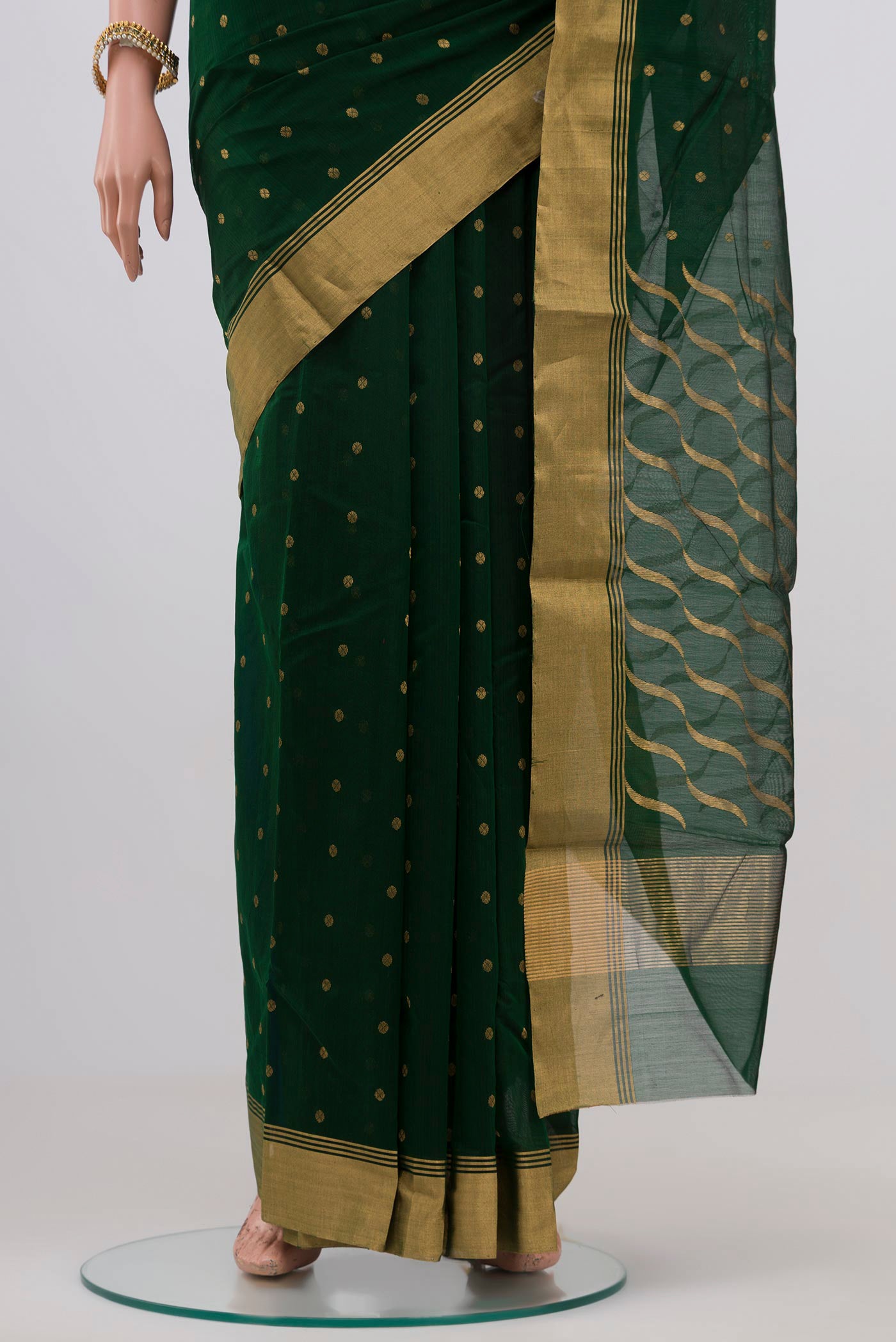 Pleats and pallu of Bottle Green Chanderi Silk Saree with Zari Butta on the body and Zari Border. 