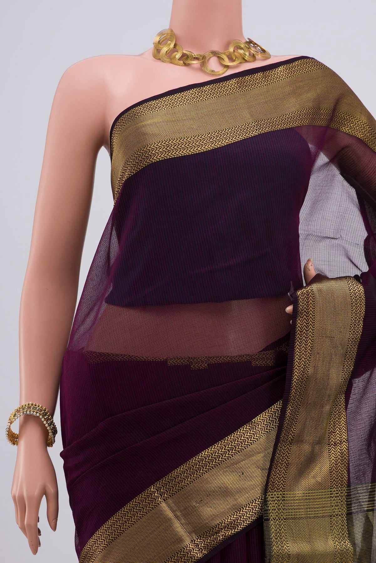 Border image of Purple Maheshwari Silk Saree with Stripes on the body and Zari Border. 