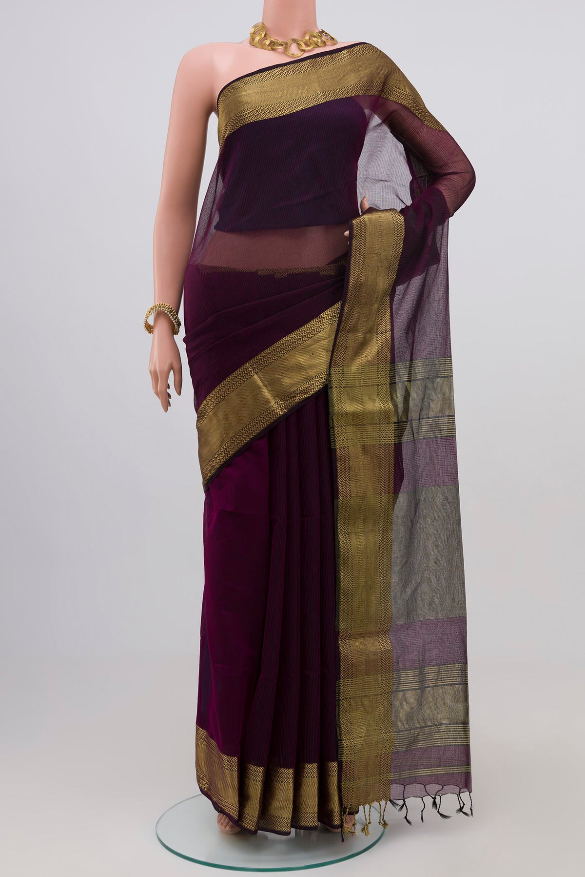 Purple Maheshwari Silk Saree with Stripes on the body and Zari Border.  displayed on a mannequin