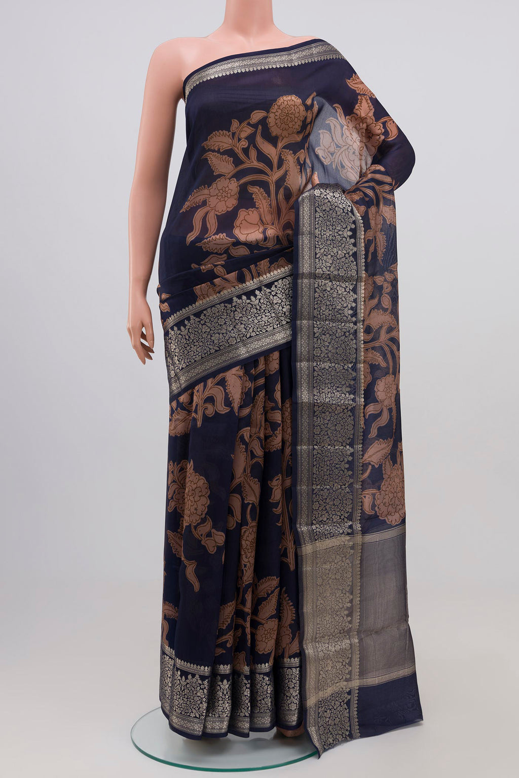Blue Raw Silk Saree with Printed design on the body and Plain Border.  displayed on a mannequin
