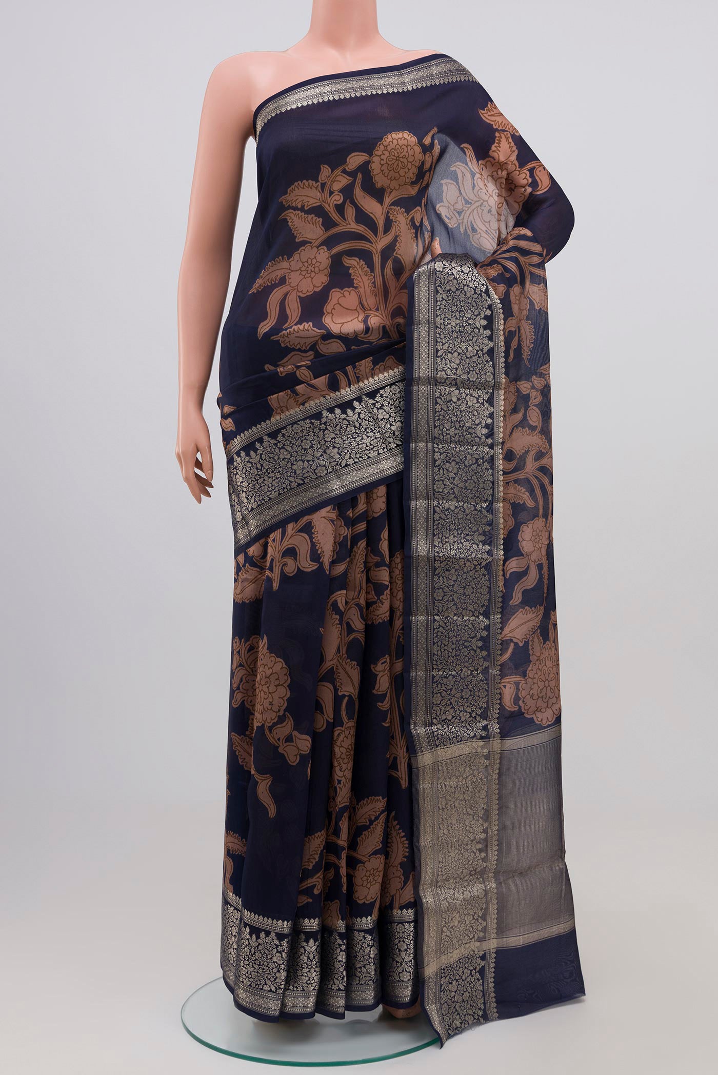 Blue Raw Silk Saree with Printed design on the body and Plain Border.  displayed on a mannequin