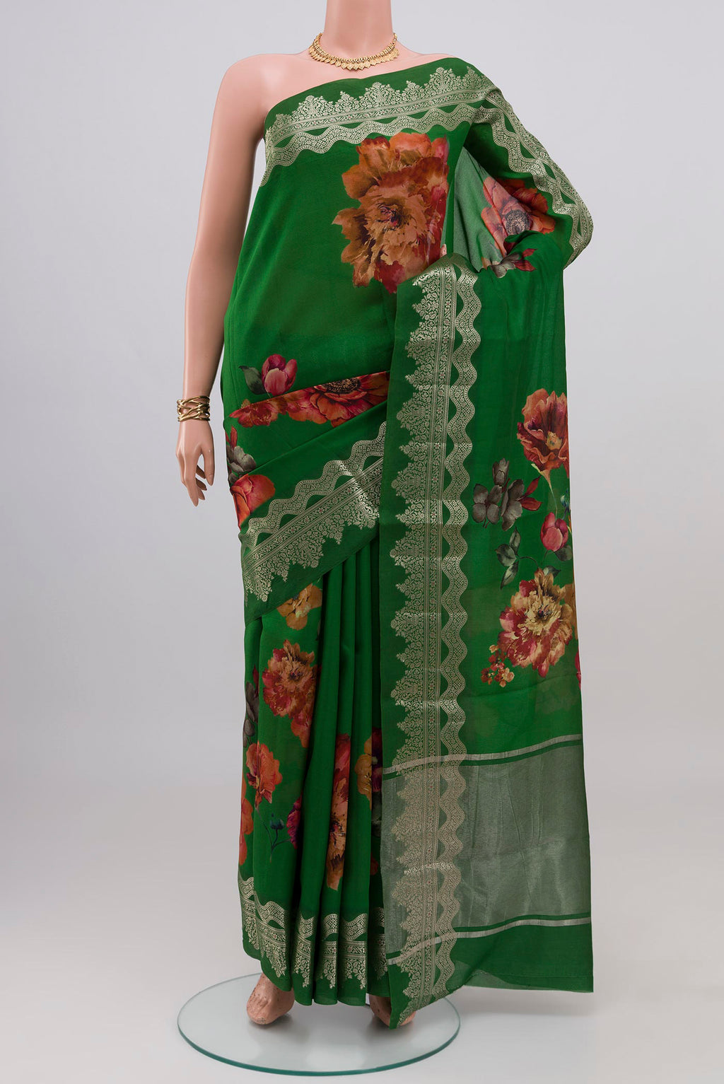 Green Raw Silk Saree with Floral Print on the body and Fancy Border.  displayed on a mannequin