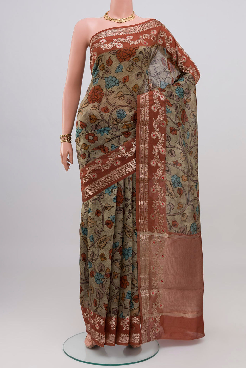 Beige Raw Silk Saree with Printed design on the body and Fancy Border.  displayed on a mannequin
