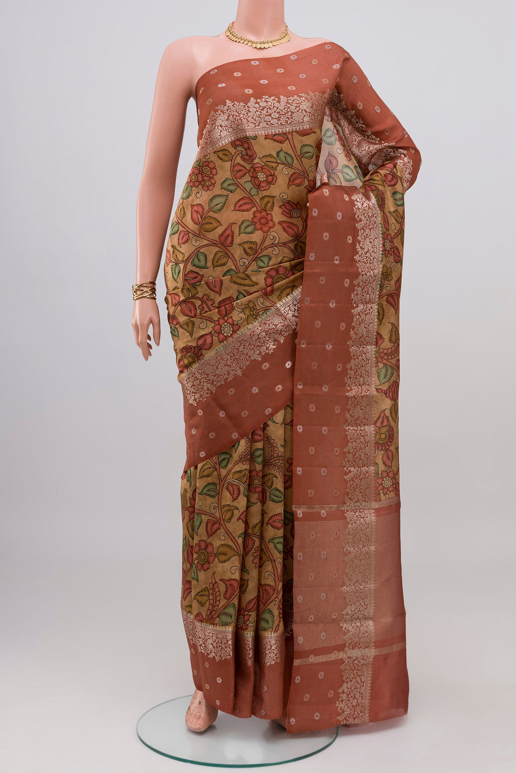Beige Raw Silk Saree with Printed design on the body and Fancy Border.  displayed on a mannequin