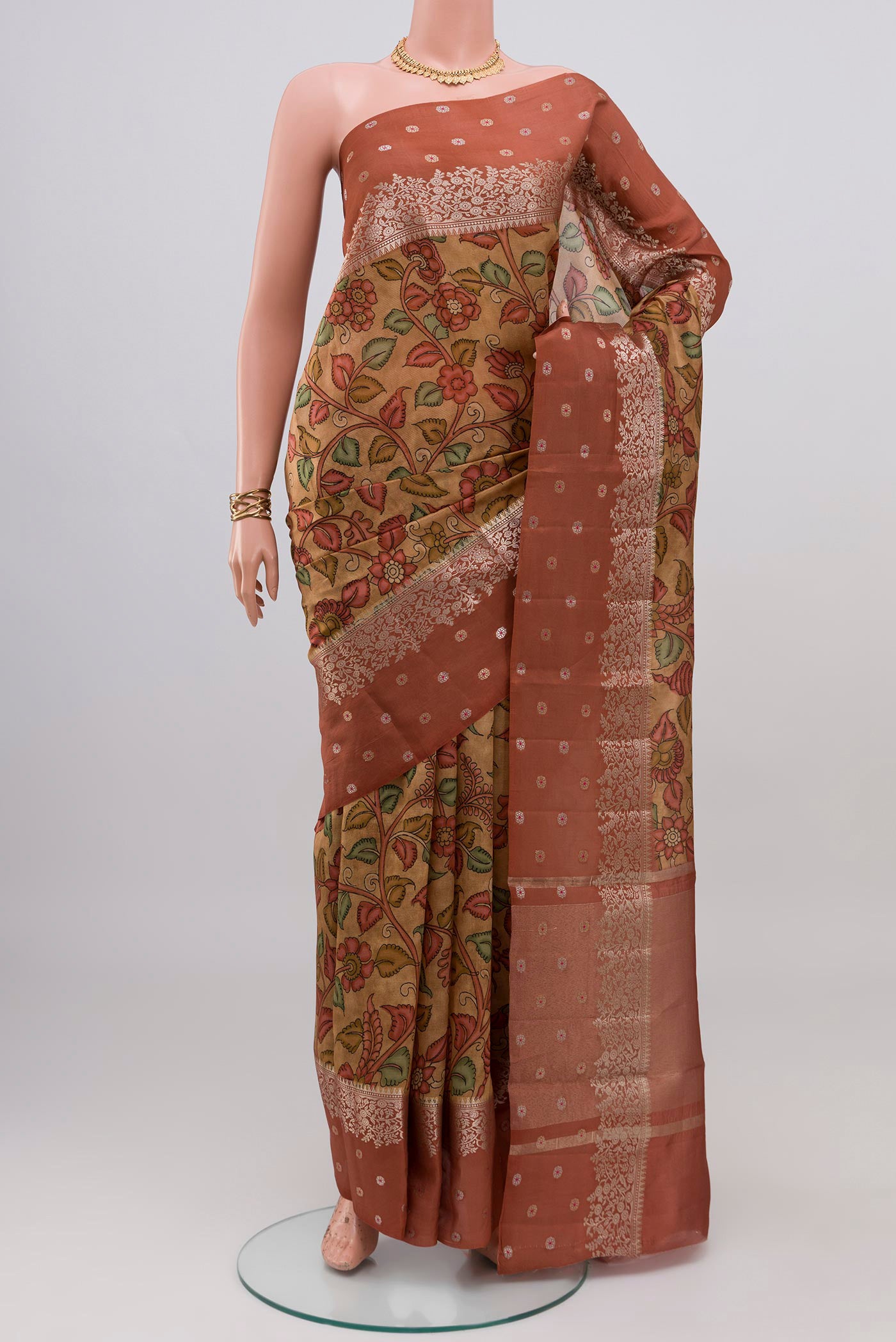 Beige Raw Silk Saree with Printed design on the body and Fancy Border.  displayed on a mannequin