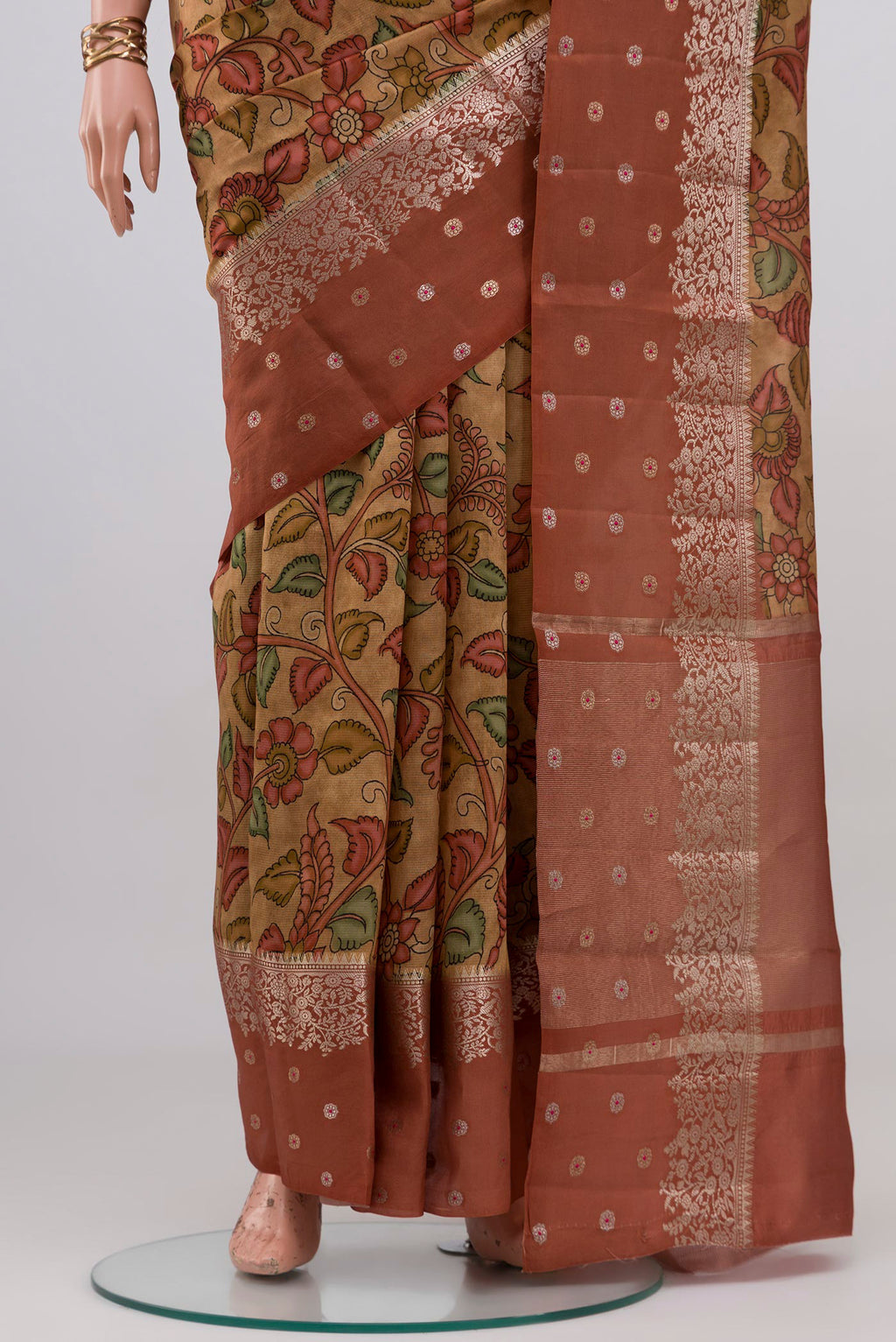 Pleats and pallu of Beige Raw Silk Saree with Printed design on the body and Fancy Border. 