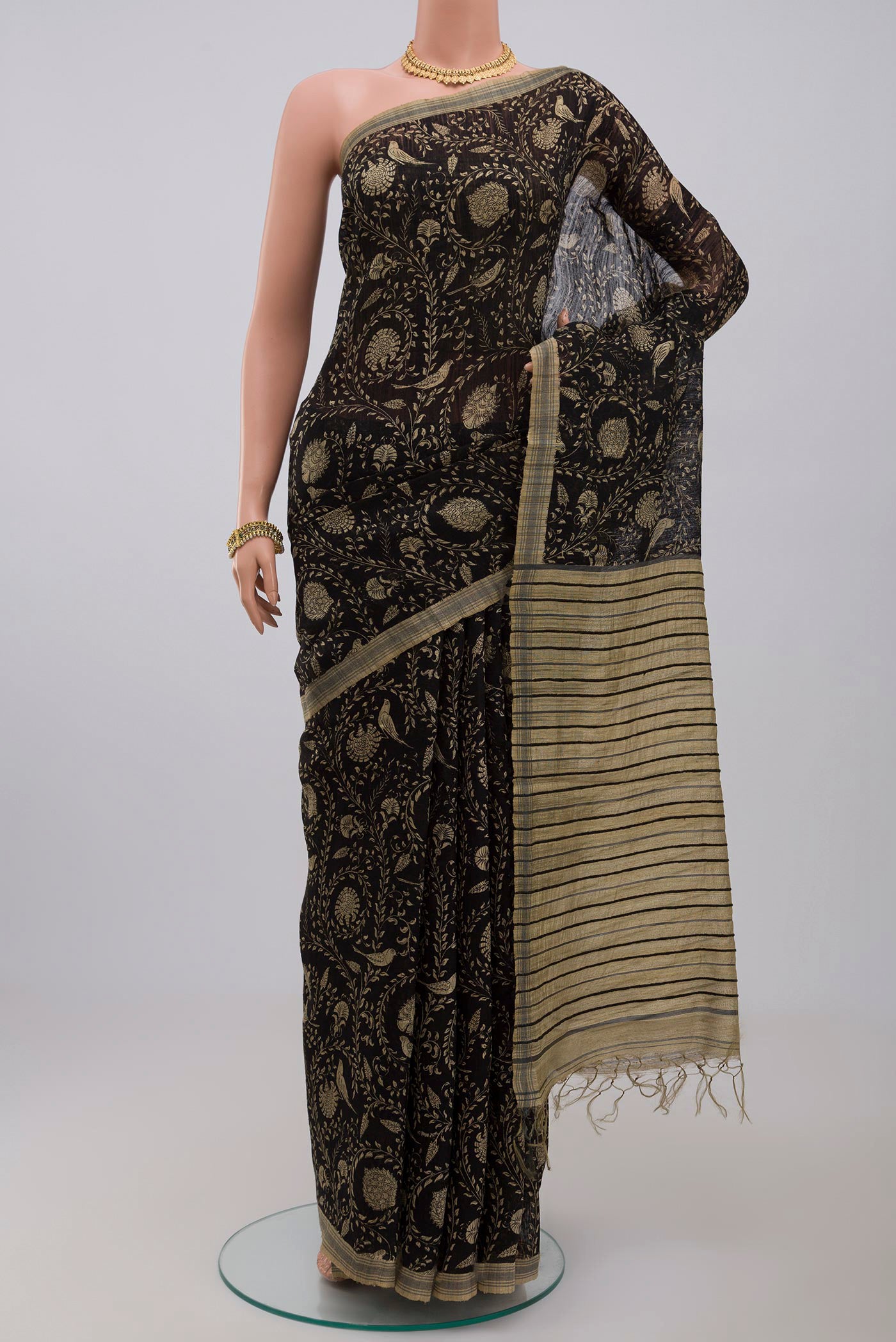 Black Jute Silk Saree with Fancy on the body and Without Border.  displayed on a mannequin