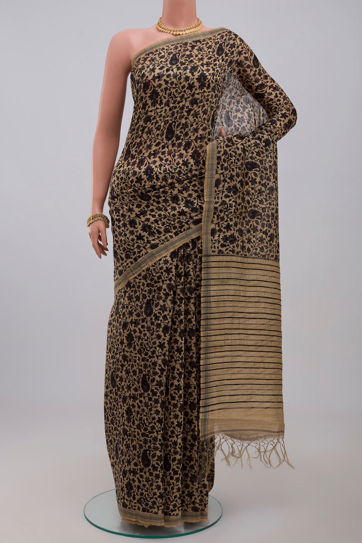 Cream Jute Silk Saree with Fancy on the body and Without Border.  displayed on a mannequin