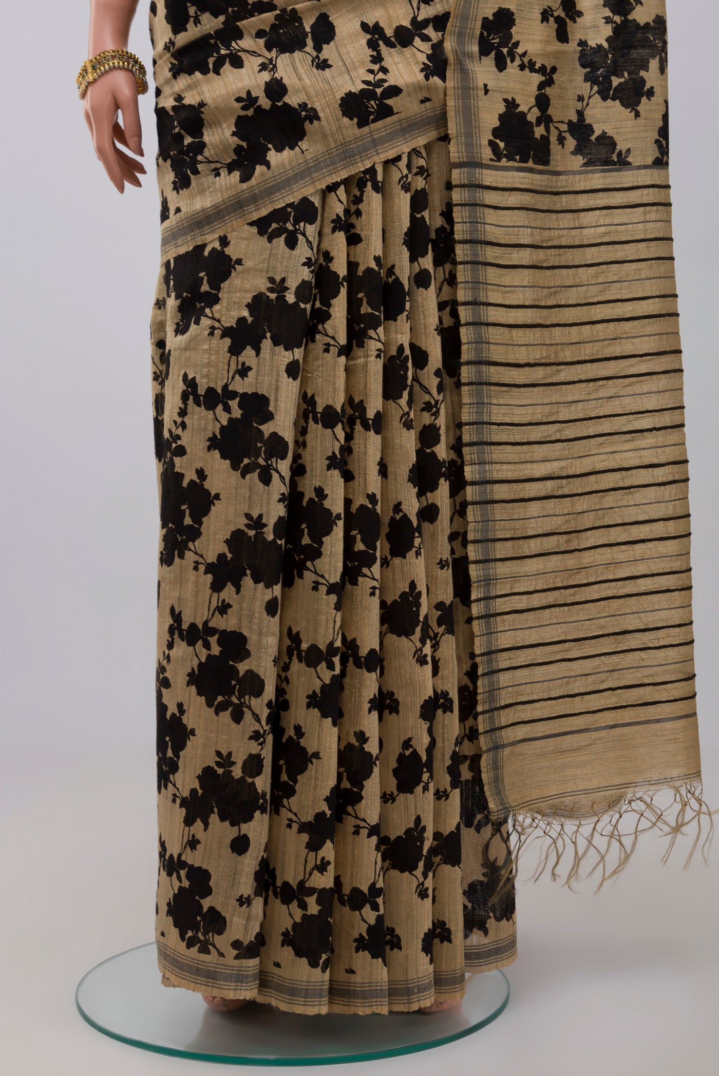 Pleats and pallu of Cream Jute Silk Saree with Fancy on the body and Without Border. 