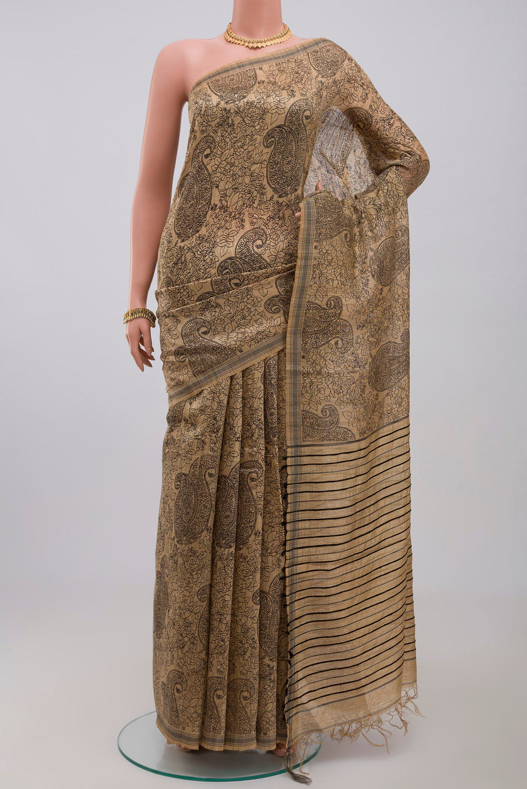 Cream Jute Silk Saree with Fancy on the body and Without Border.  displayed on a mannequin