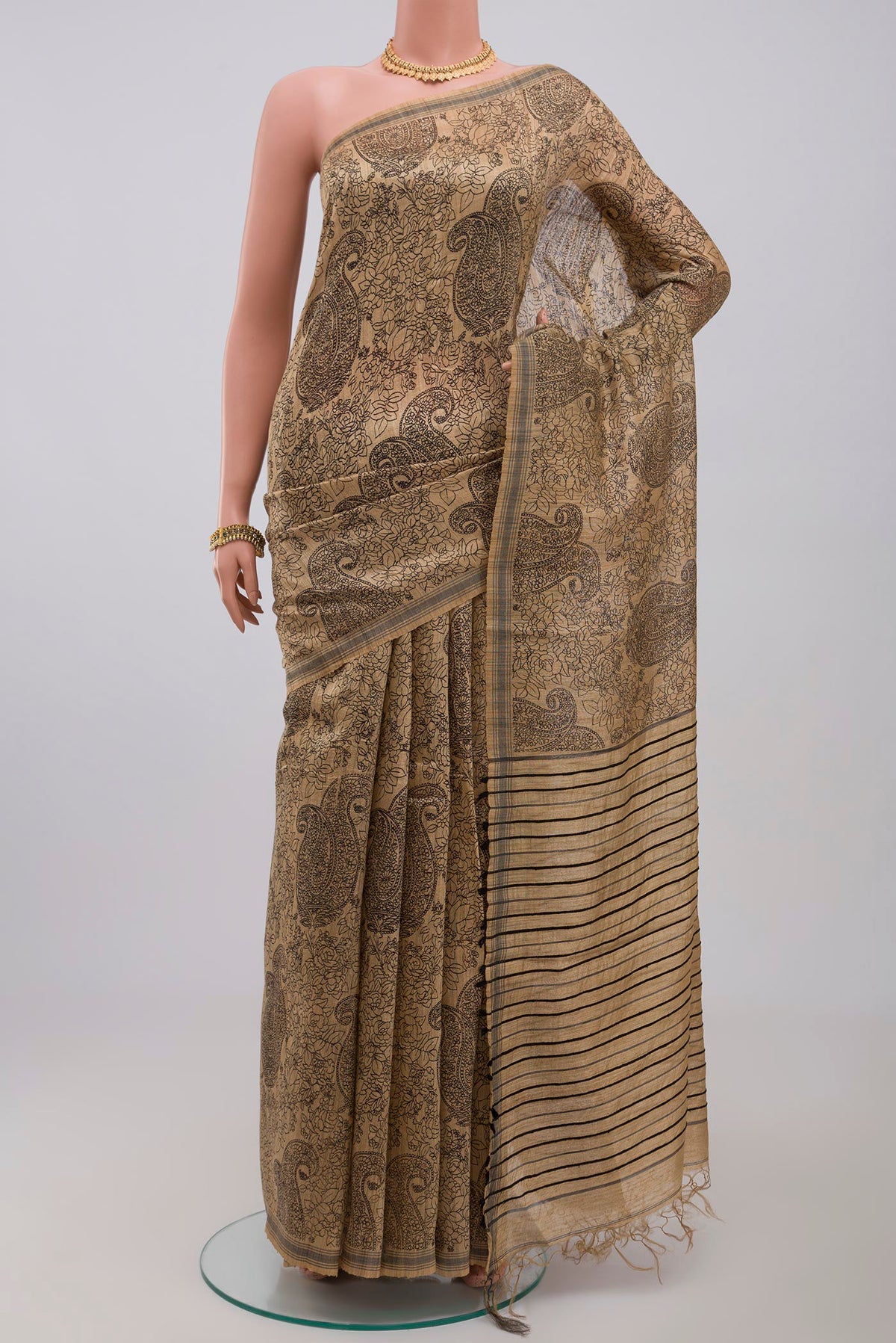 Cream Jute Silk Saree with Fancy on the body and Without Border.  displayed on a mannequin