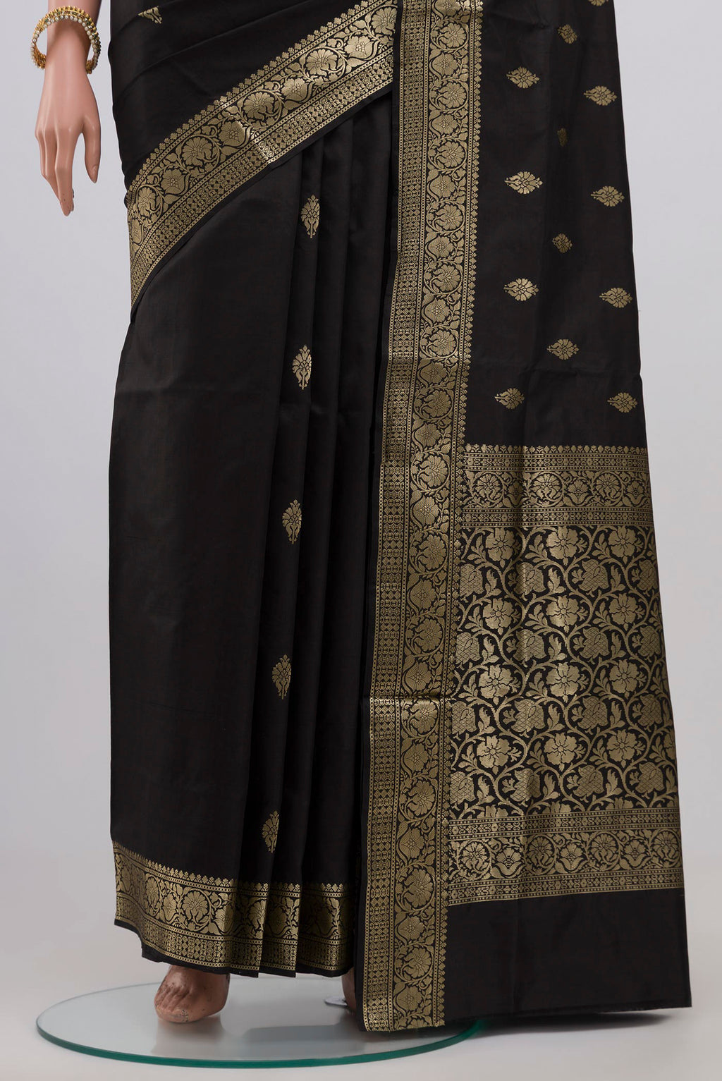 Pleats and pallu of Black Banarasi Katan Silk Saree with Zari Butta on the body and Zari Border. 