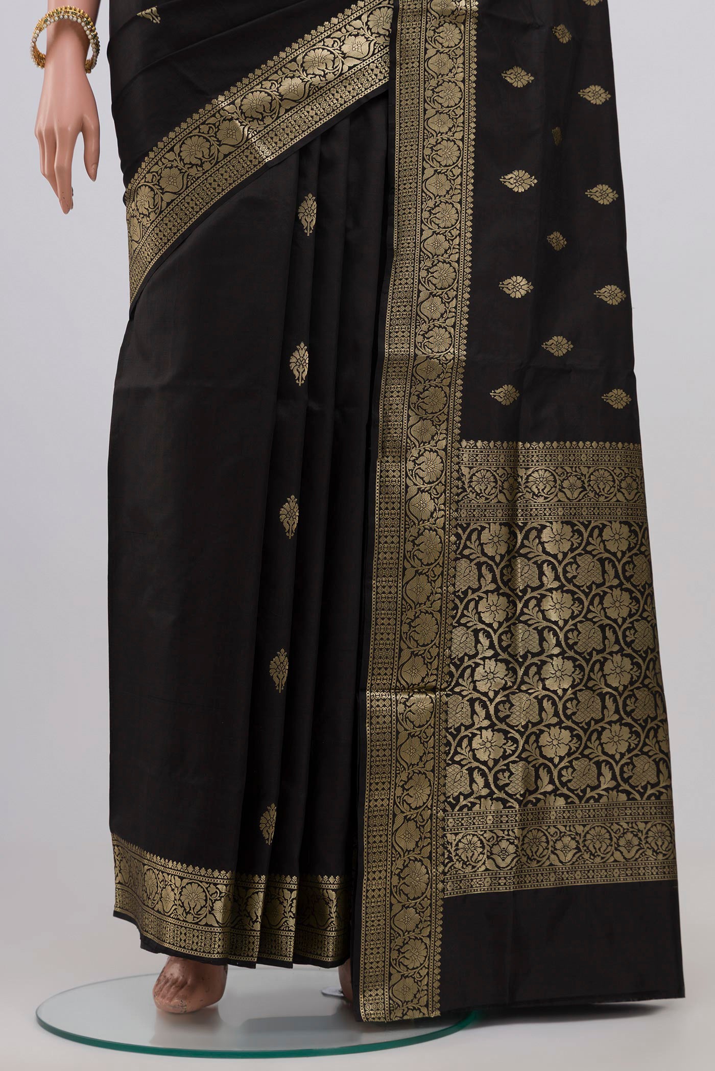 Pleats and pallu of Black Banarasi Katan Silk Saree with Zari Butta on the body and Zari Border. 