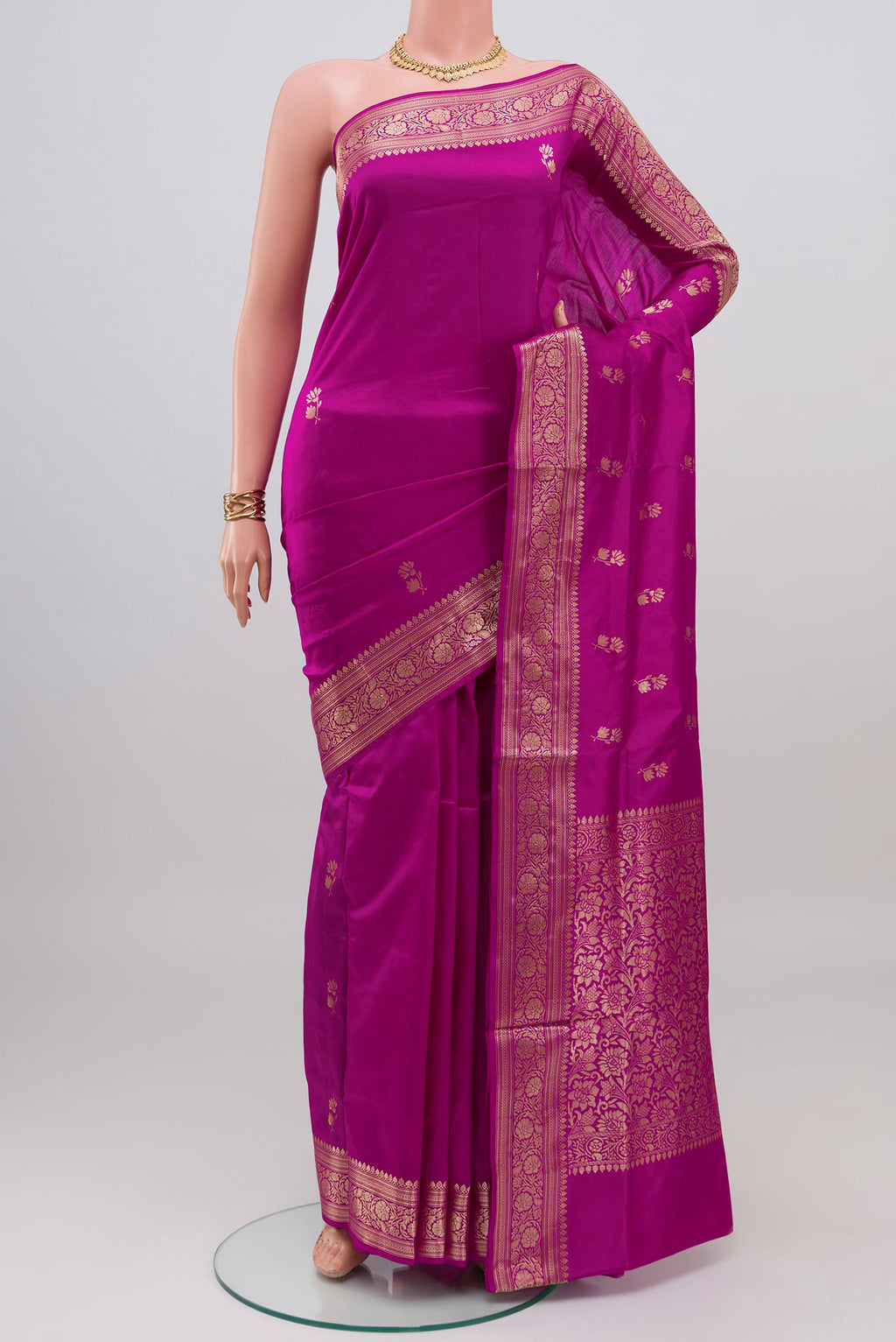 Purple Banarasi Katan Silk Saree with Zari Butta on the body and Zari Border.  displayed on a mannequin