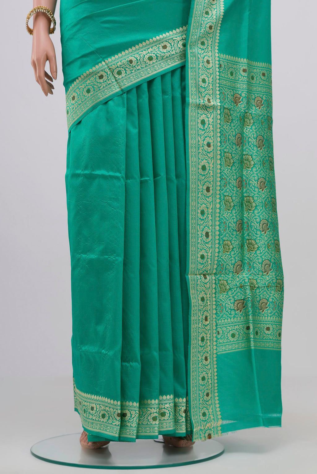 Pleats and pallu of Light Green Banarasi Katan Silk Saree with Plain Body and Thread Border. 