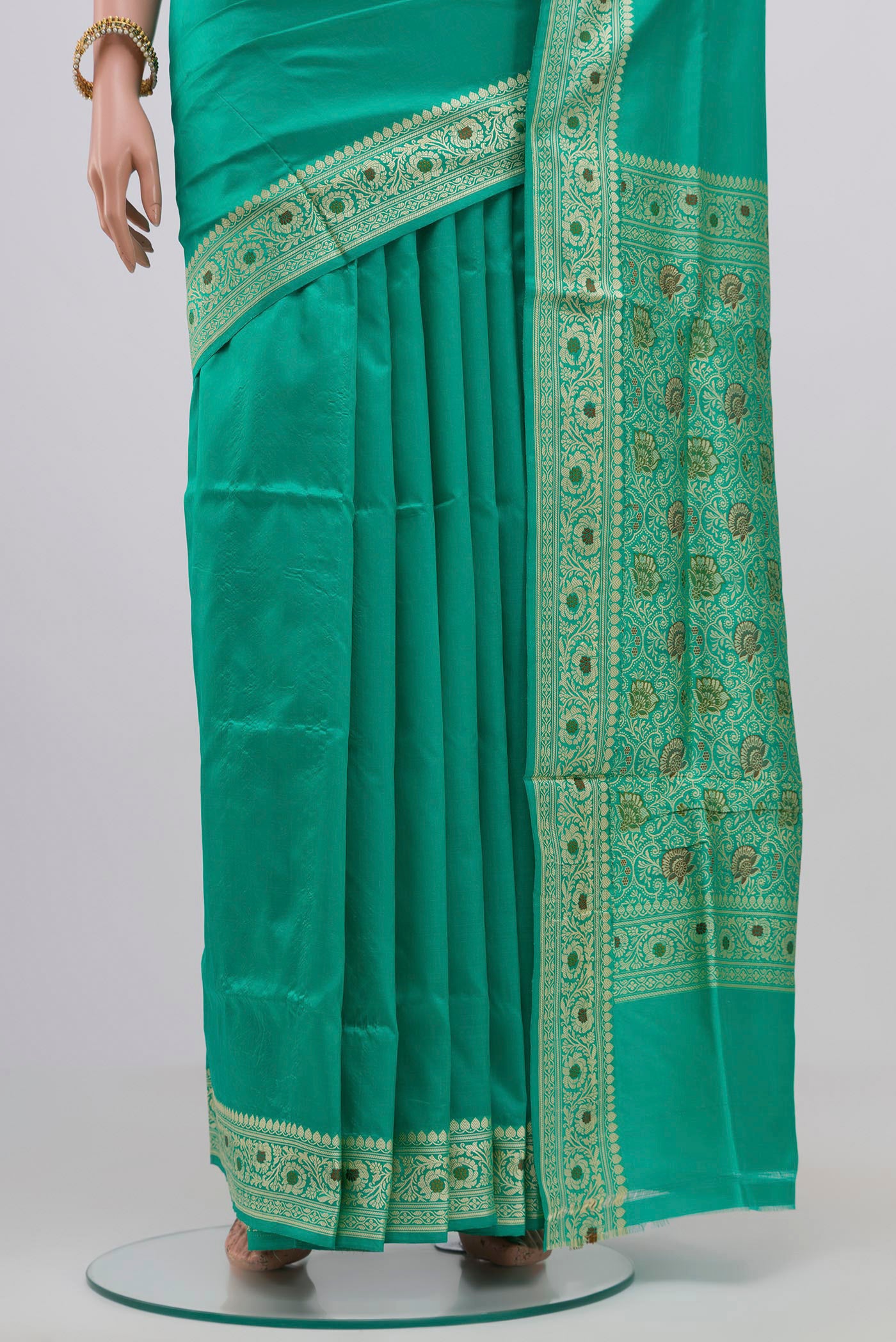 Pleats and pallu of Light Green Banarasi Katan Silk Saree with Plain Body and Thread Border. 