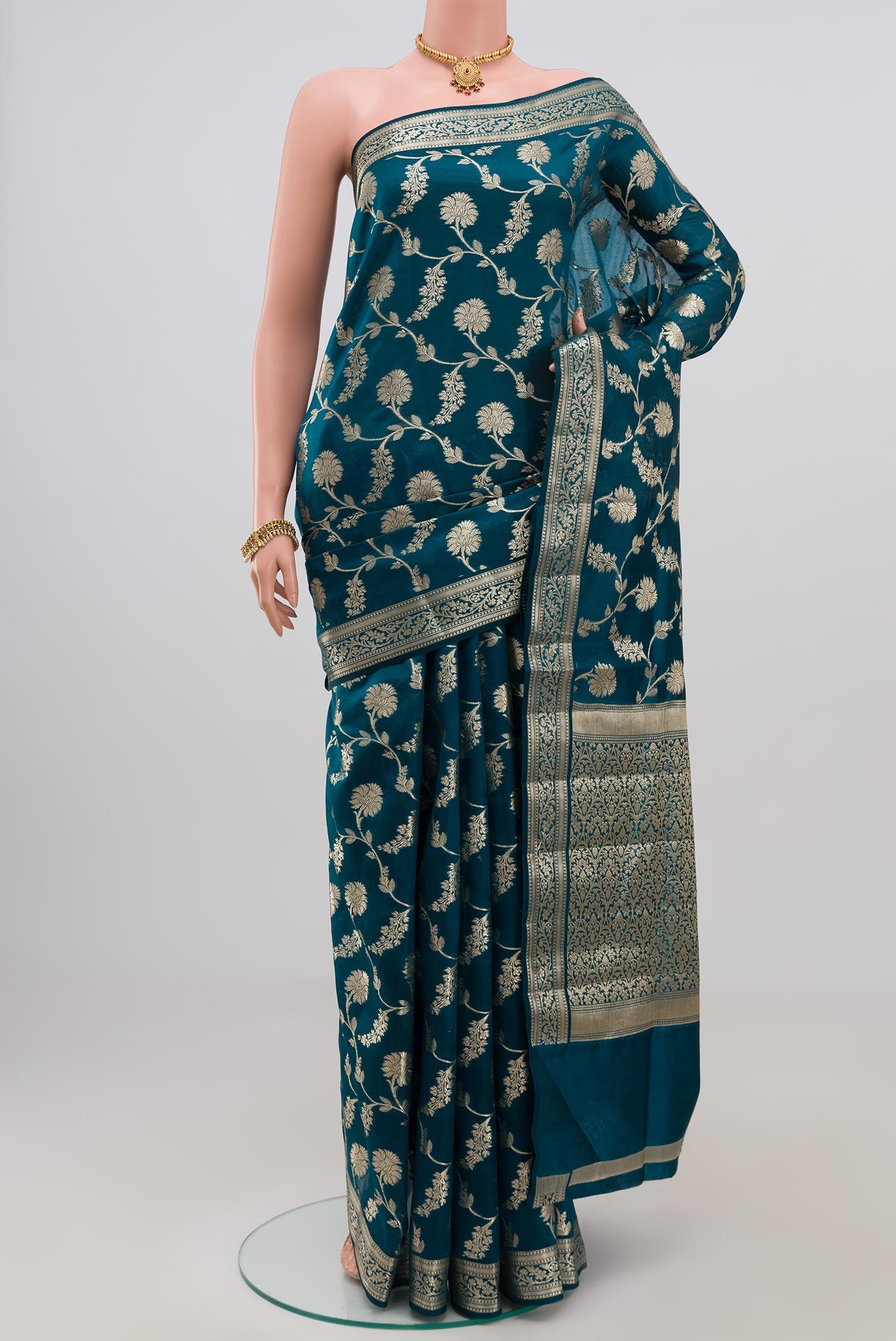 Blue Raw Silk Saree with Fancy on the body and Zari Border.  displayed on a mannequin