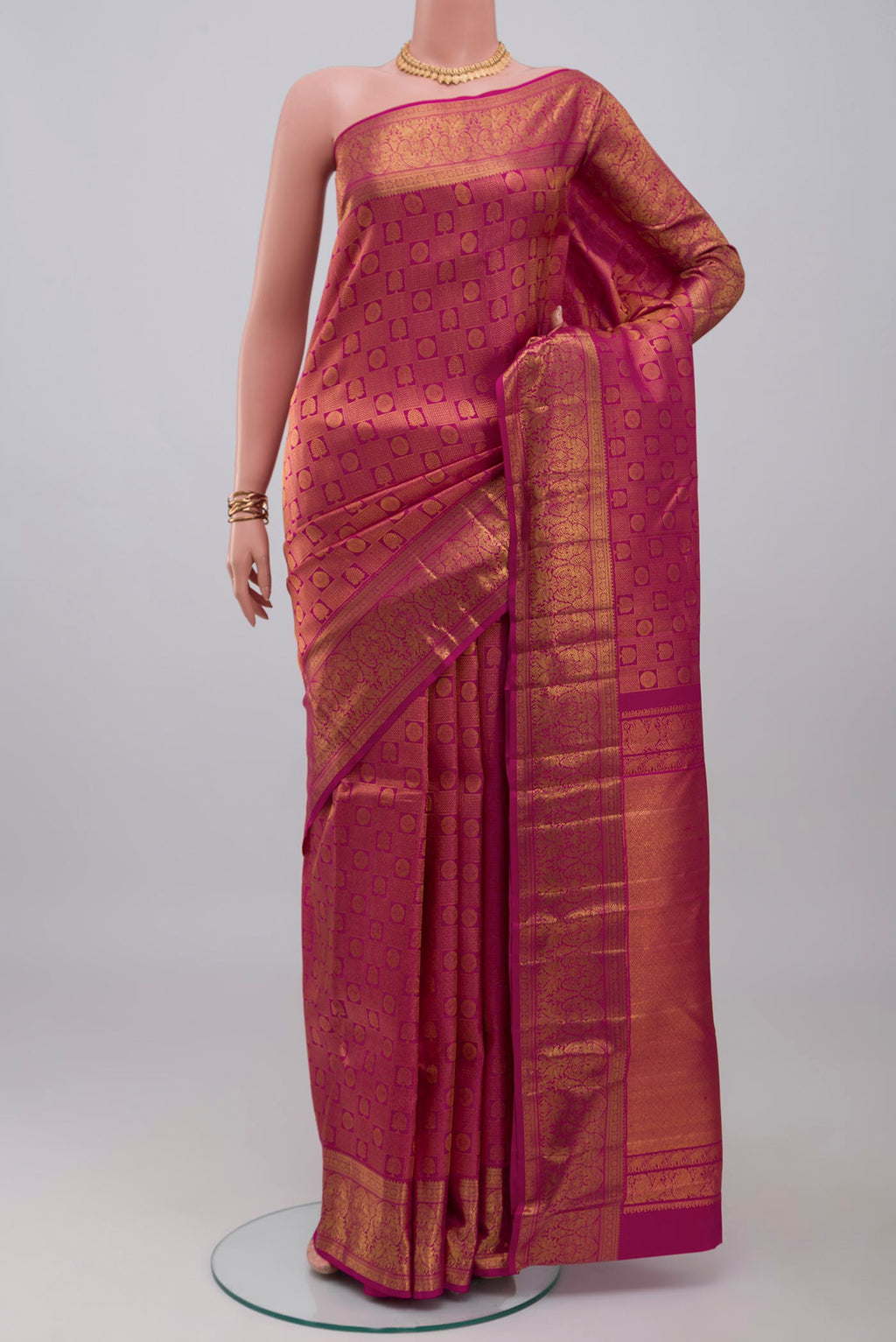 Light Magenta Kanchipuram Silk Saree with Zari Brocade on the body and Zari Border.  displayed on a mannequin
