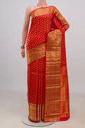 Pure Silk Red Kanchipuram Saree with Zari Brocade on the body and Zari Border.  displayed on a mannequin