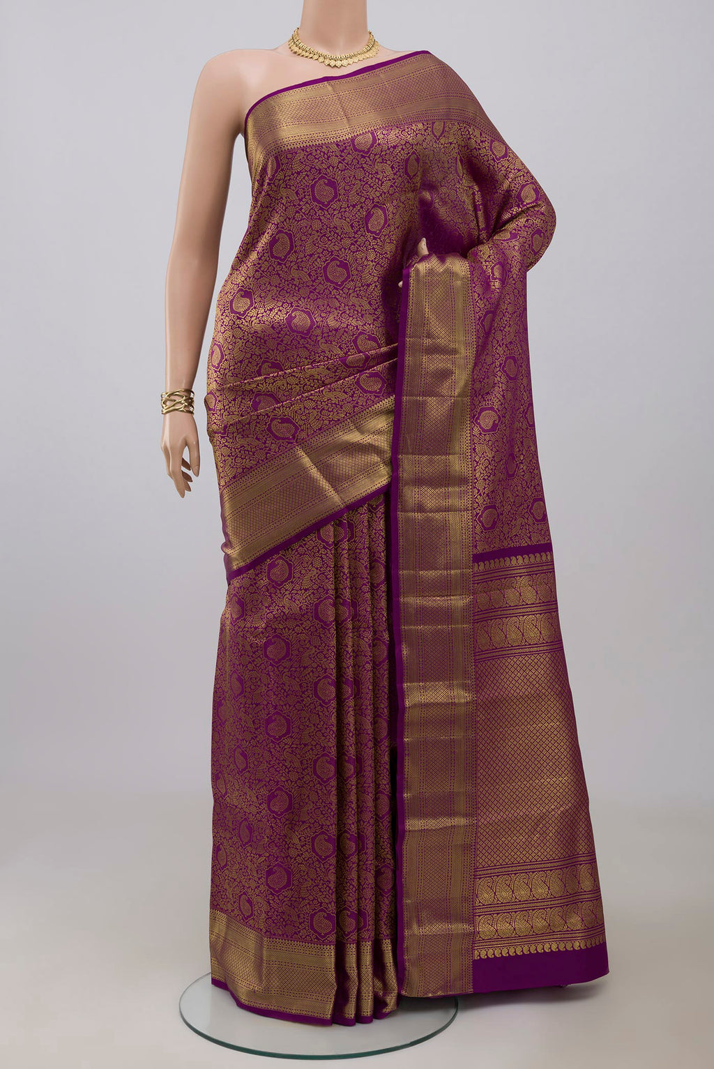 Purple Kanchipuram Silk Saree with Zari Brocade on the body and Zari Border.  displayed on a mannequin