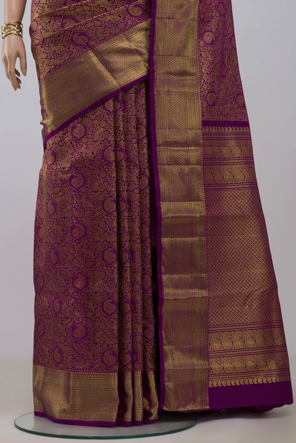 Pleats and pallu of Purple Kanchipuram Silk Saree with Zari Brocade on the body and Zari Border. 