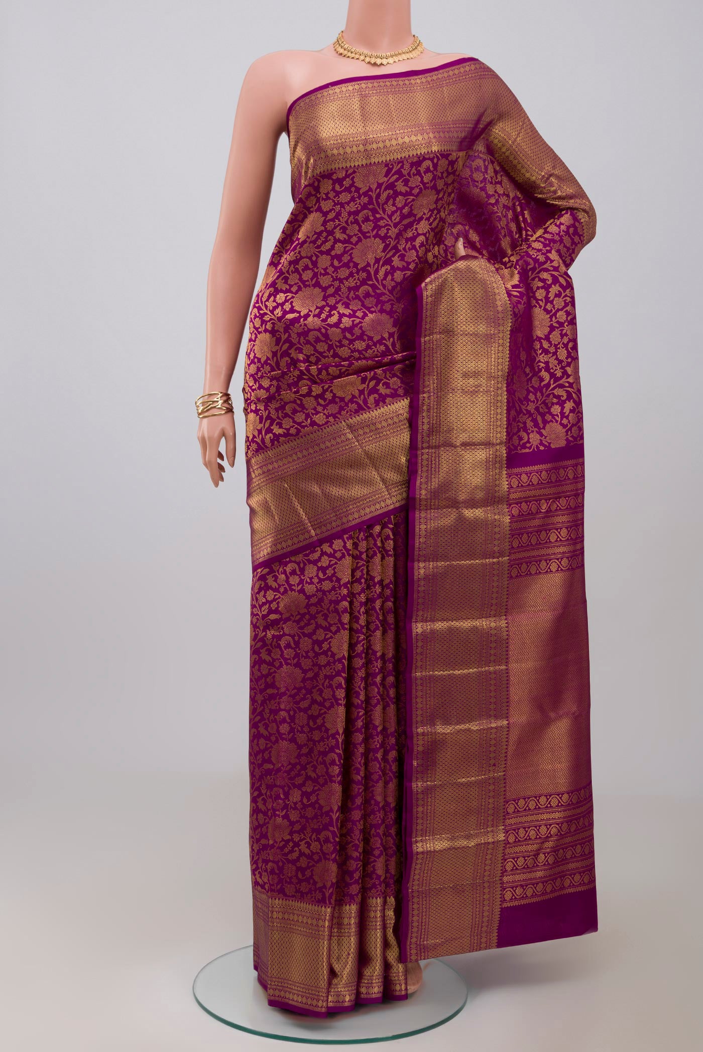 Purple Kanchipuram Silk Saree with Zari Brocade on the body and Zari Border.  displayed on a mannequin