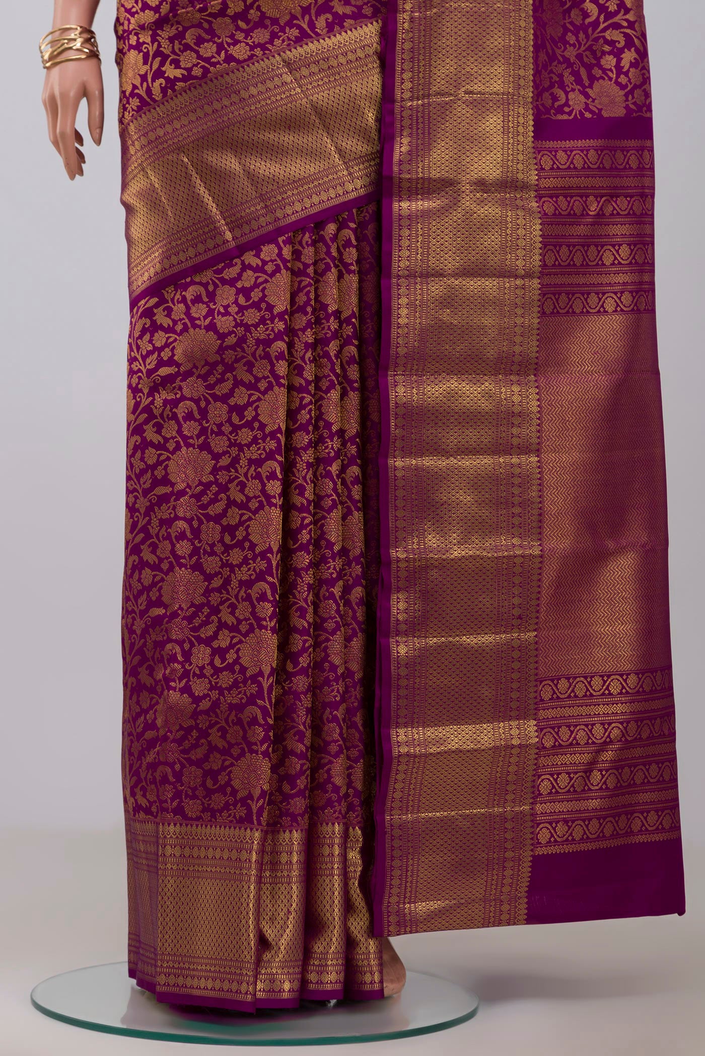Pleats and pallu of Purple Kanchipuram Silk Saree with Zari Brocade on the body and Zari Border. 