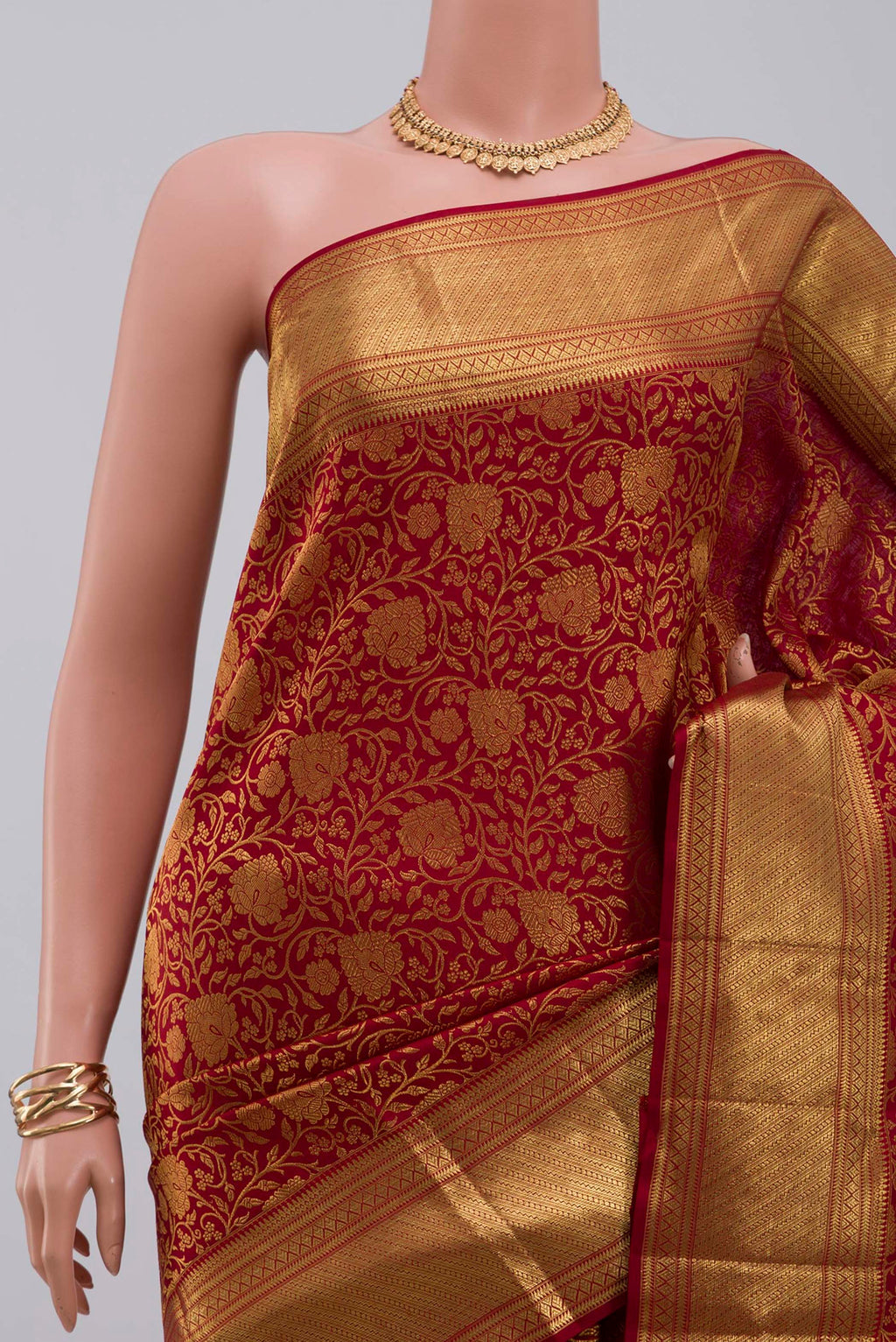 Border image of Maroon Kanchipuram Saree with Zari Brocade on the body and Zari Border. 