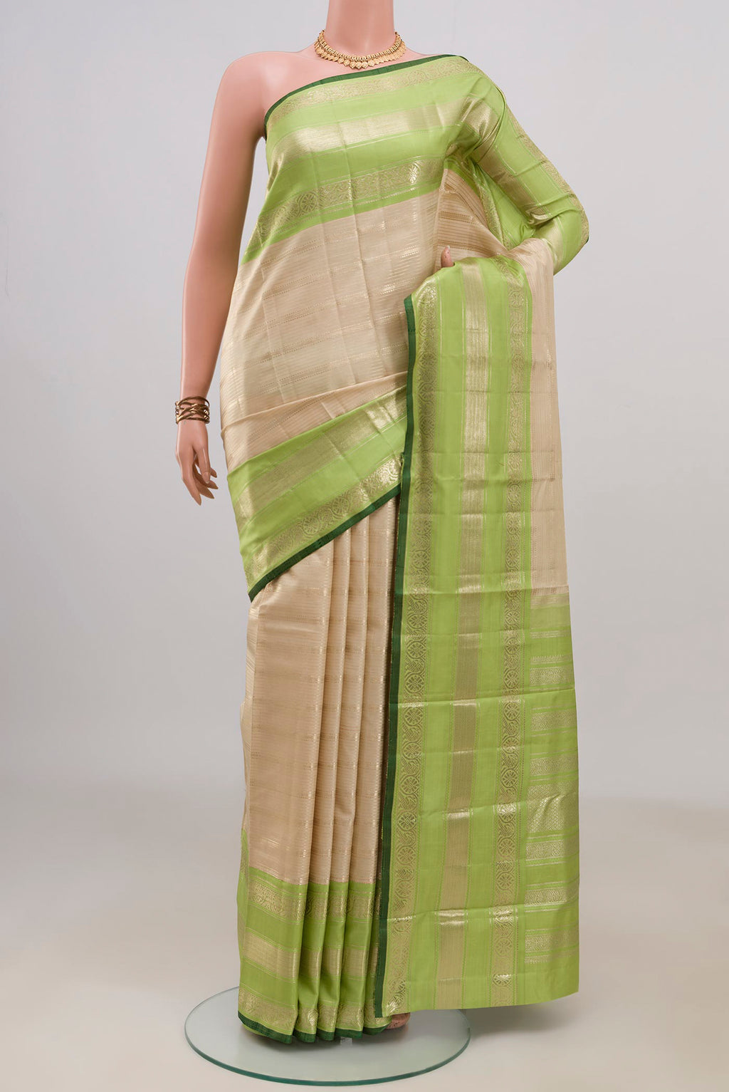Pure Silk Beige Kanchipuram Saree with Stripes on the body and Zari Border.  displayed on a mannequin