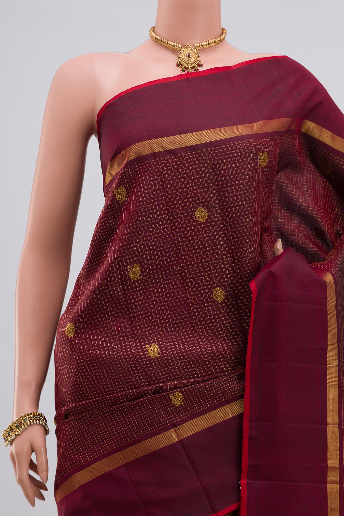 Border image of Maroon Kanjivaram Saree with Checked design on the body and Thin Zari Line. 