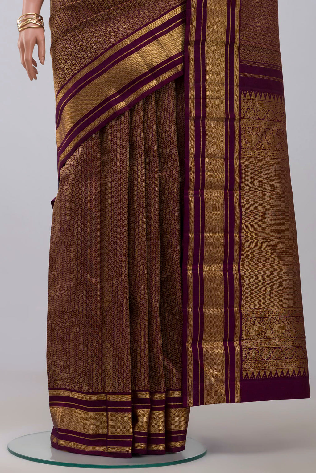 Pleats and pallu of Pure Silk Pure Zari Purple Kanchipuram Saree with Jacquard design on the body and Zari Border. 