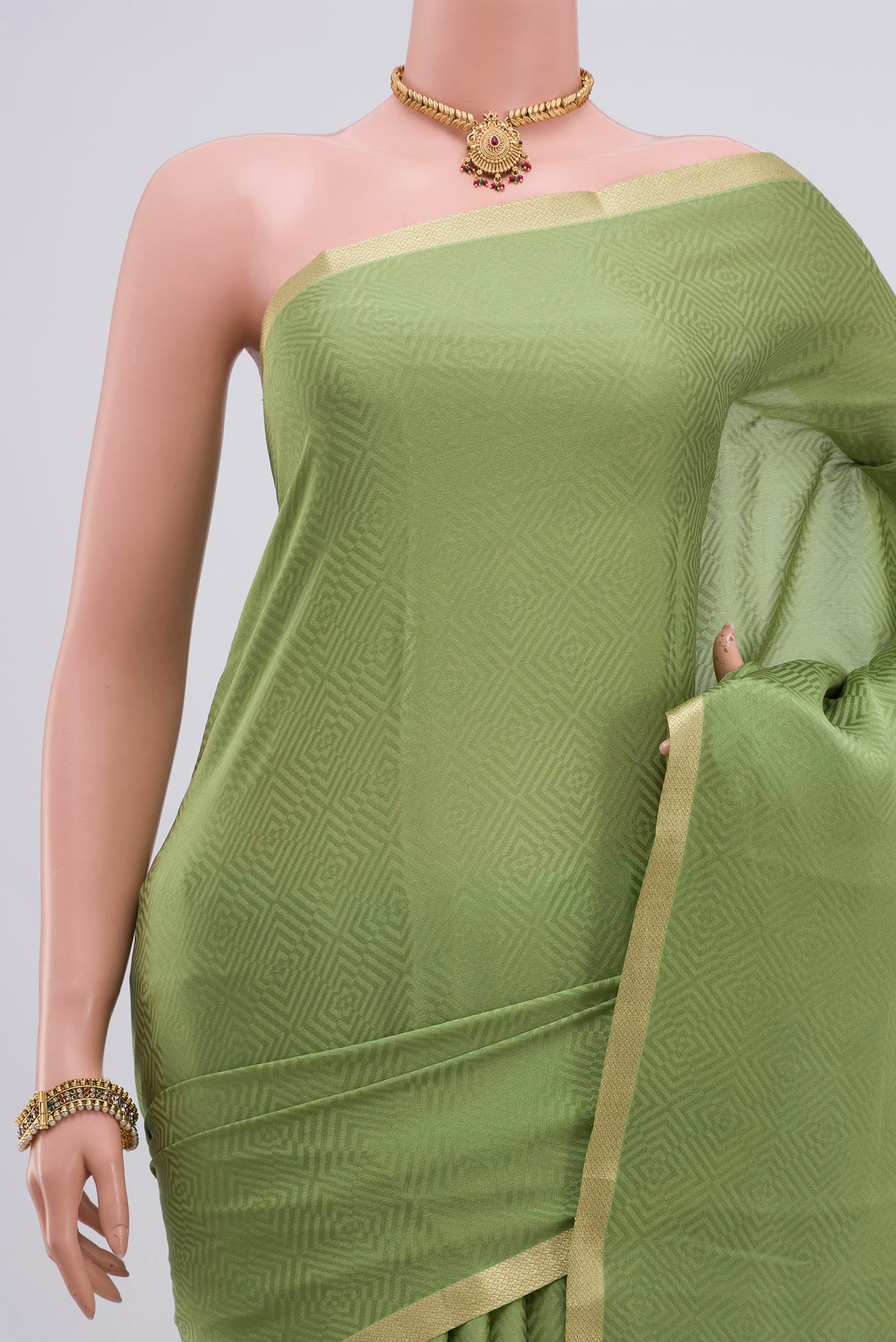 Border image of Green Crepe Saree with Jacquard design on the body and Zari Border. 