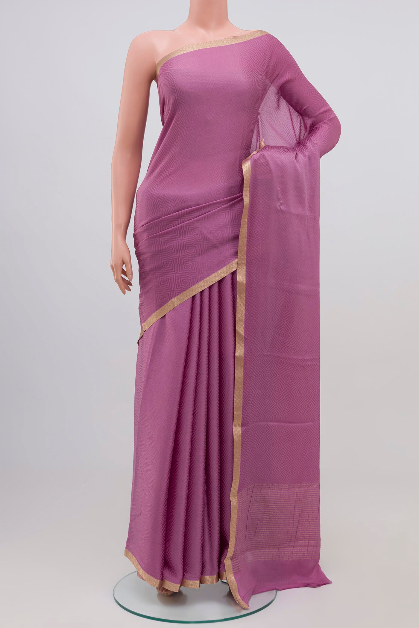 Lavender Mysore Crepe Saree with Jacquard design on the body and Zari Border.  displayed on a mannequin