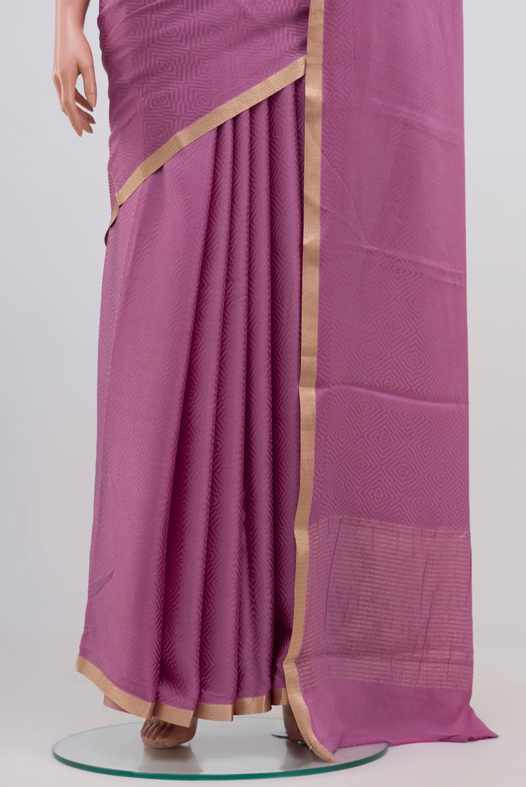 Pleats and pallu of Lavender Mysore Crepe Saree with Jacquard design on the body and Zari Border. 