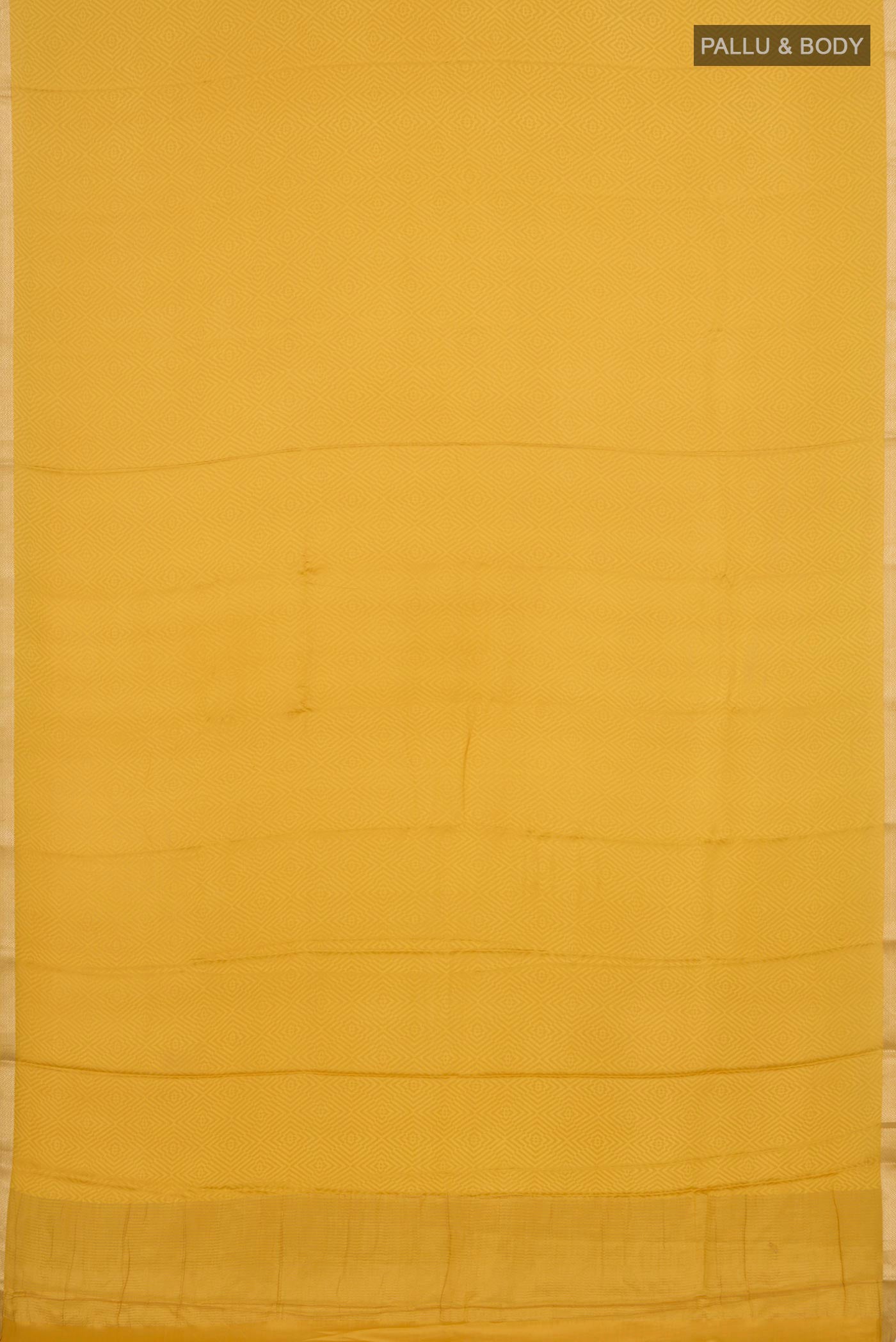 Flat view of Yellow Crepe Saree with Jacquard design on the body and Thin Zari Line. 