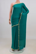 Teal Mysore Crepe Saree with Jacquard design on the body and Zari Border.  displayed on a mannequin