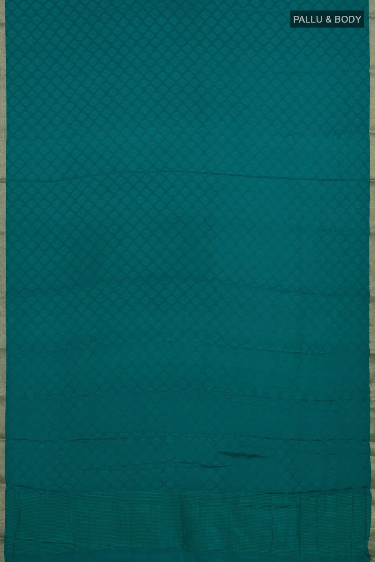 Flat view of Teal Mysore Crepe Saree with Jacquard design on the body and Zari Border. 