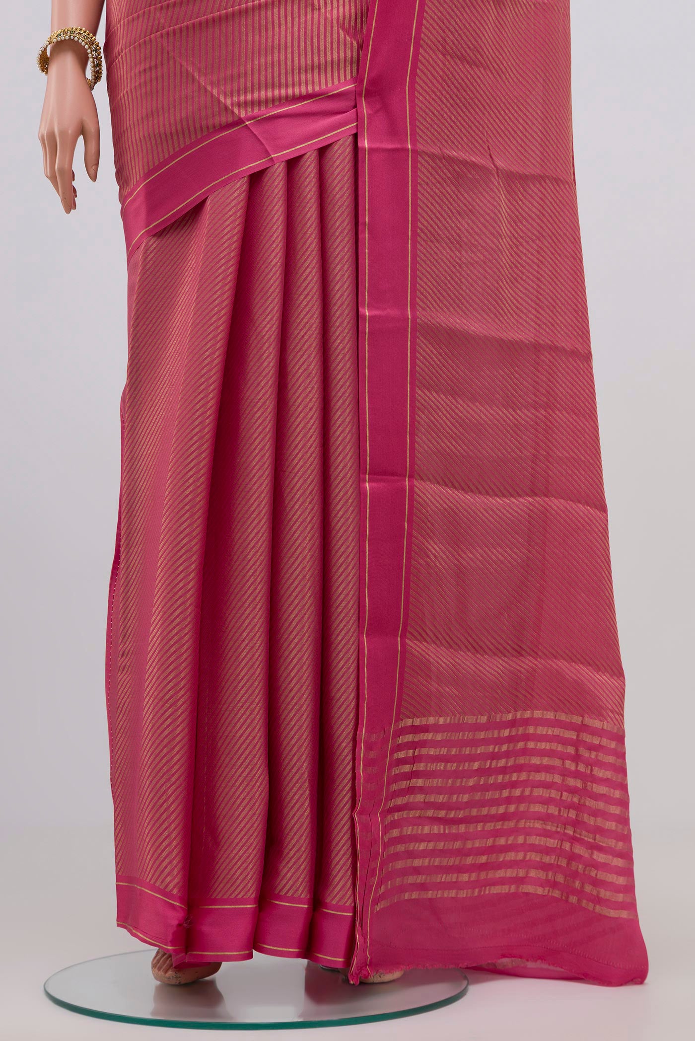 Pleats and pallu of Pink Mysore Georgette Saree with Zari Brocade on the body and Plain Border. 