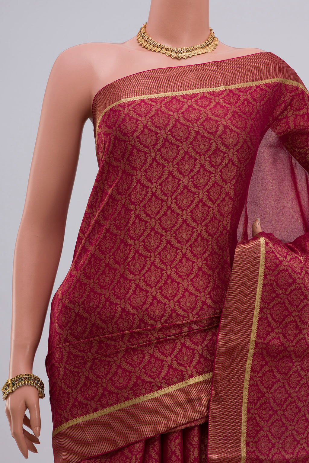 Border image of Pink Georgette Saree with Zari Brocade on the body and Zari Border. 