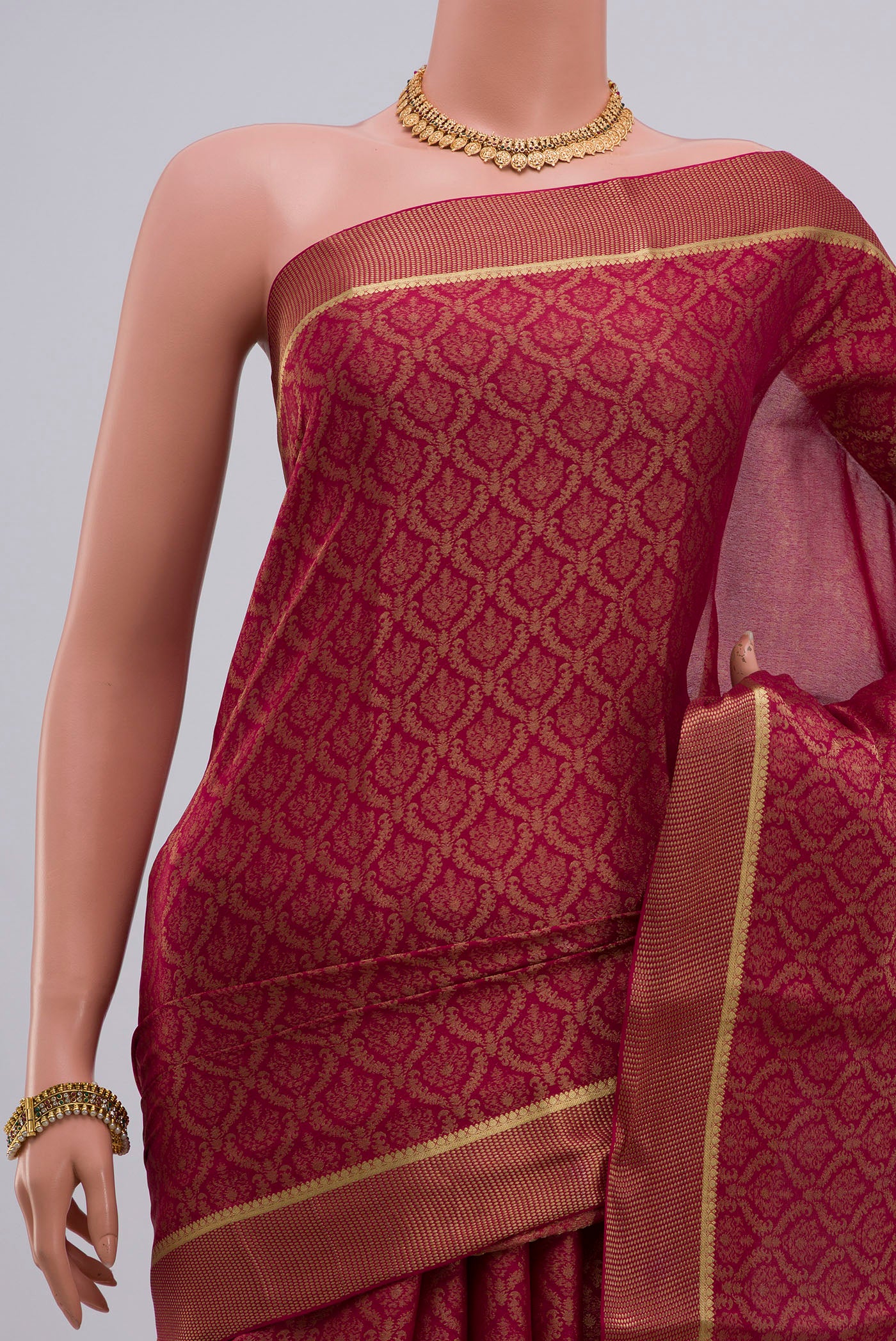 Border image of Pink Georgette Saree with Zari Brocade on the body and Zari Border. 